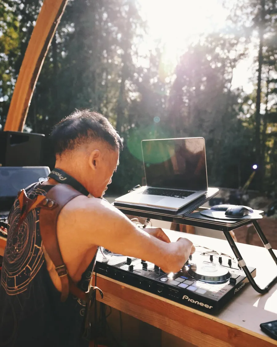 Sun Rose DJing in the forest at Soar Equinox Gathering